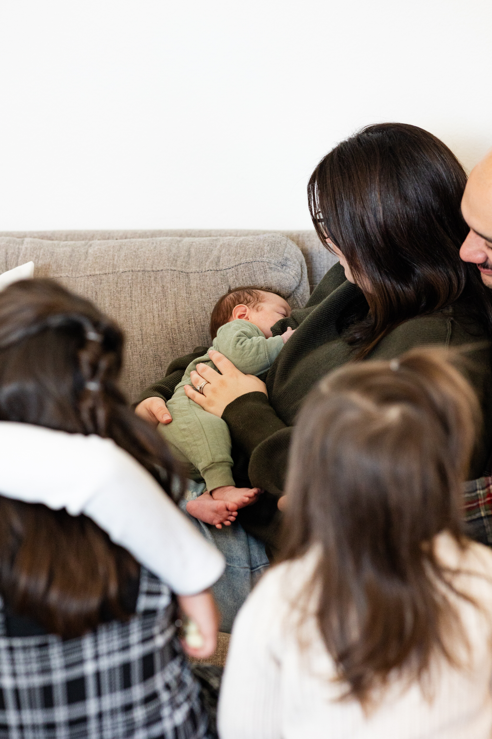 A mom breastfeeds her newborn son.