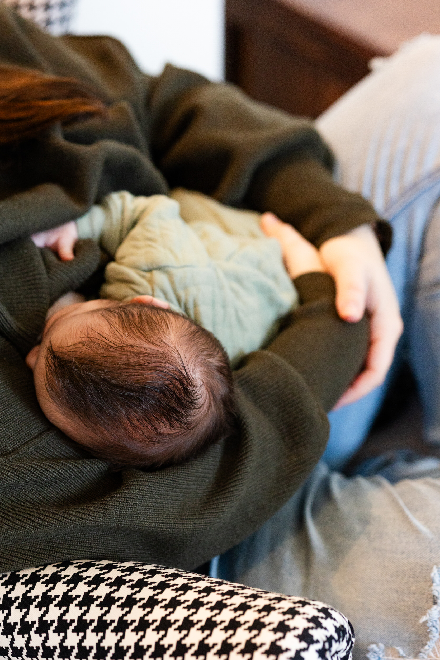 A mom breastfeeds her newborn son.