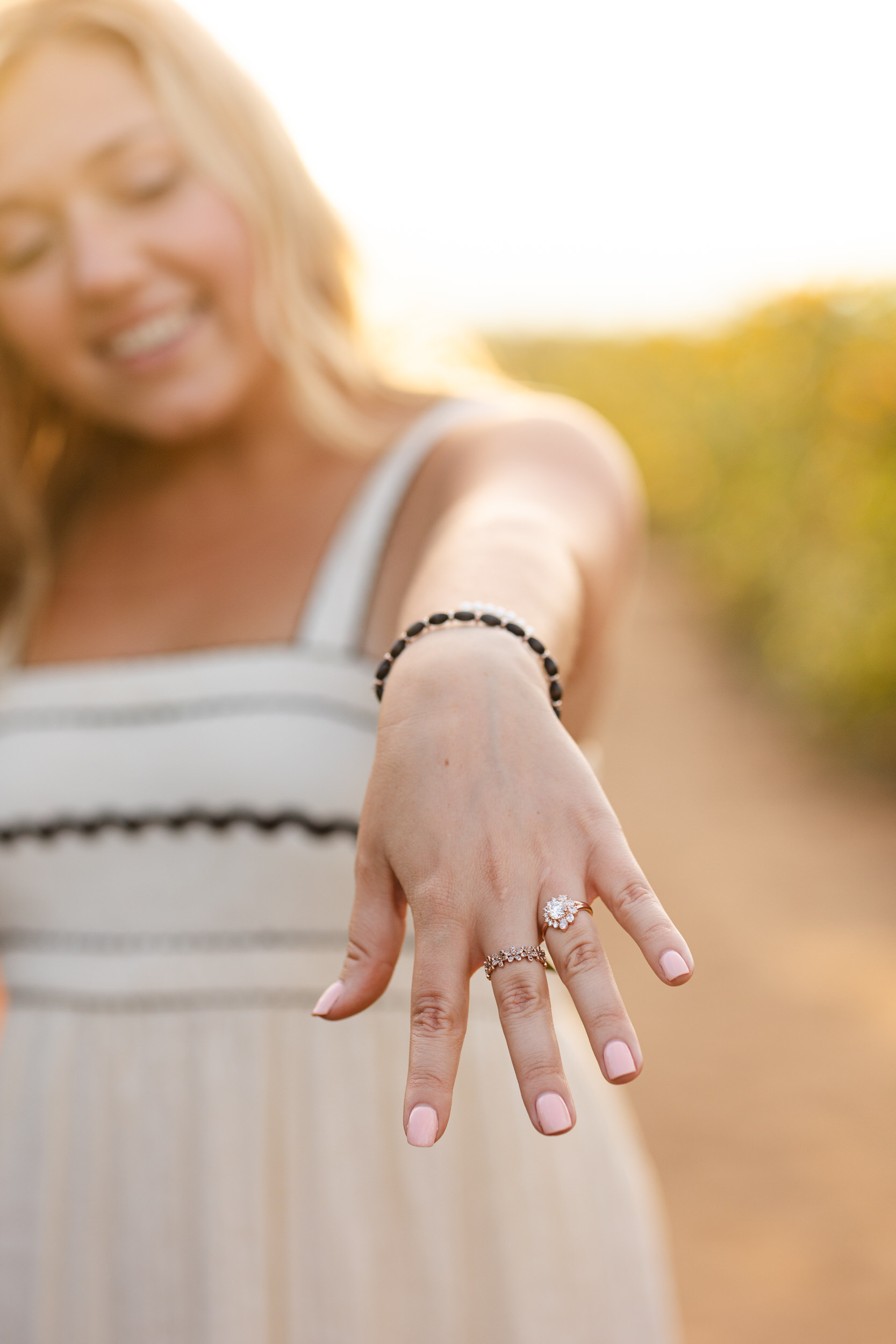 A woman shows off her new engagement ring.