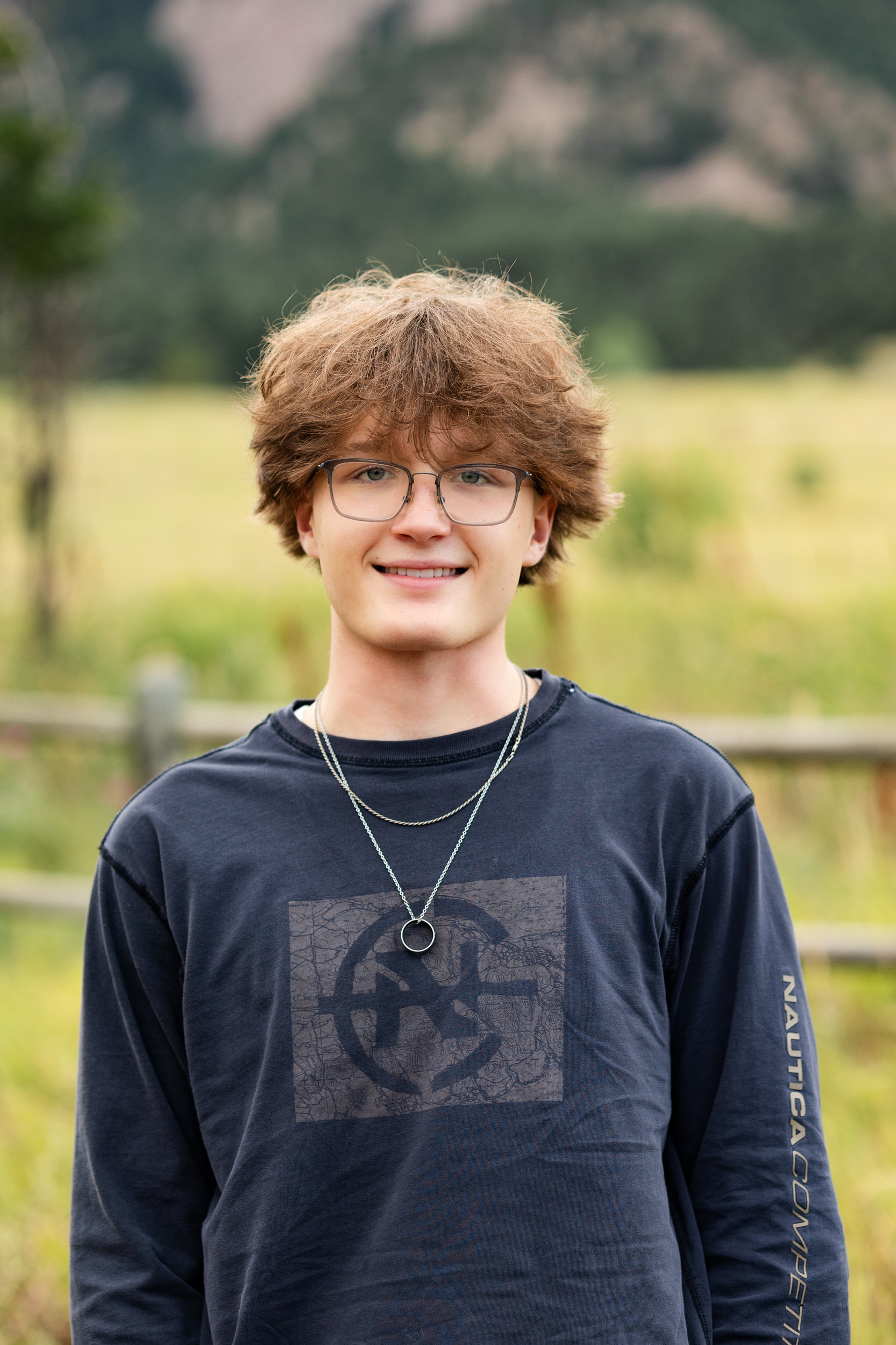 Close-up of a senior boy smiling at the camera.