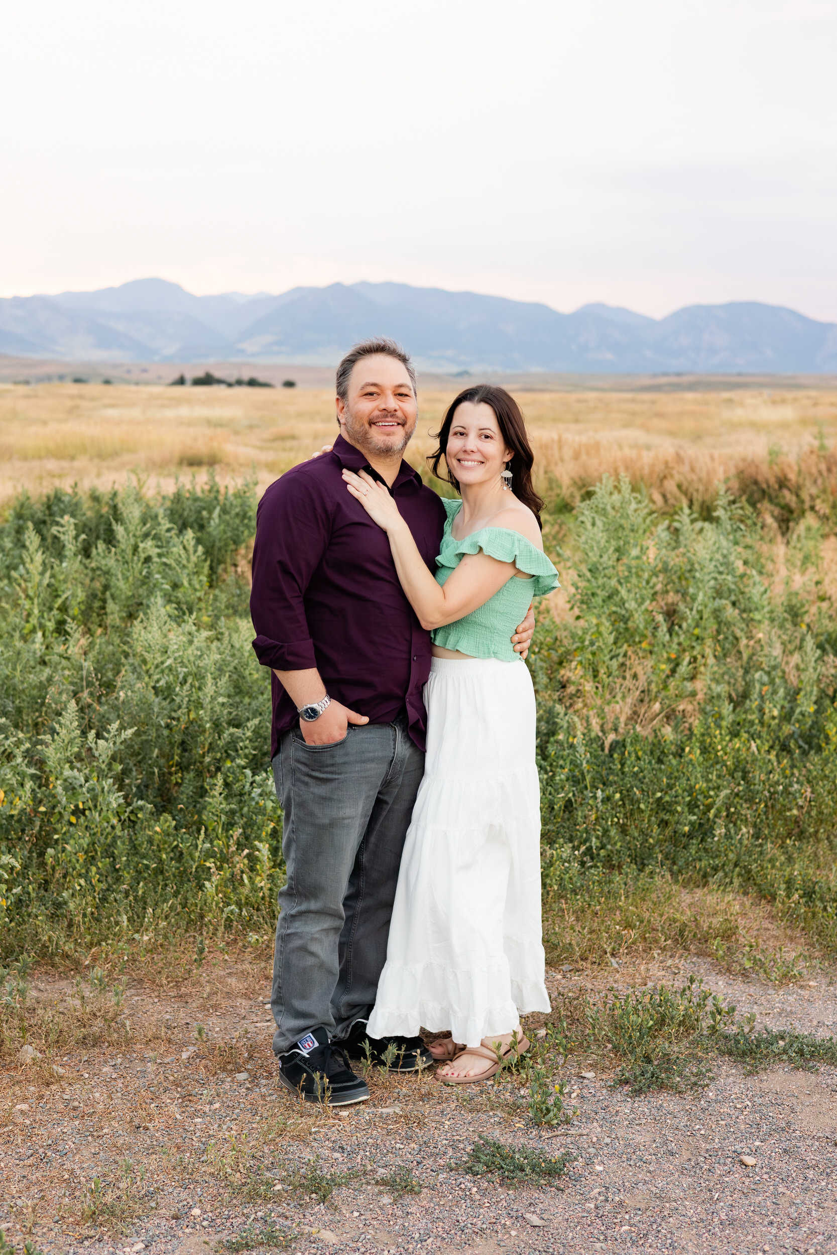 Husband and wife smile at the camera