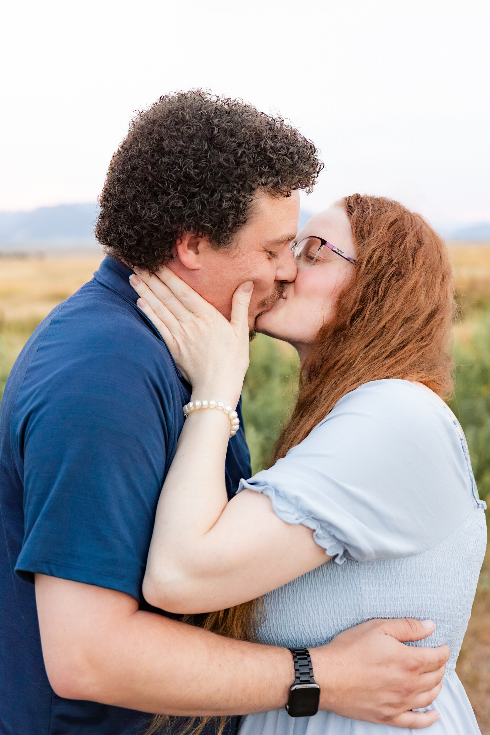 Husband and wife share a kiss