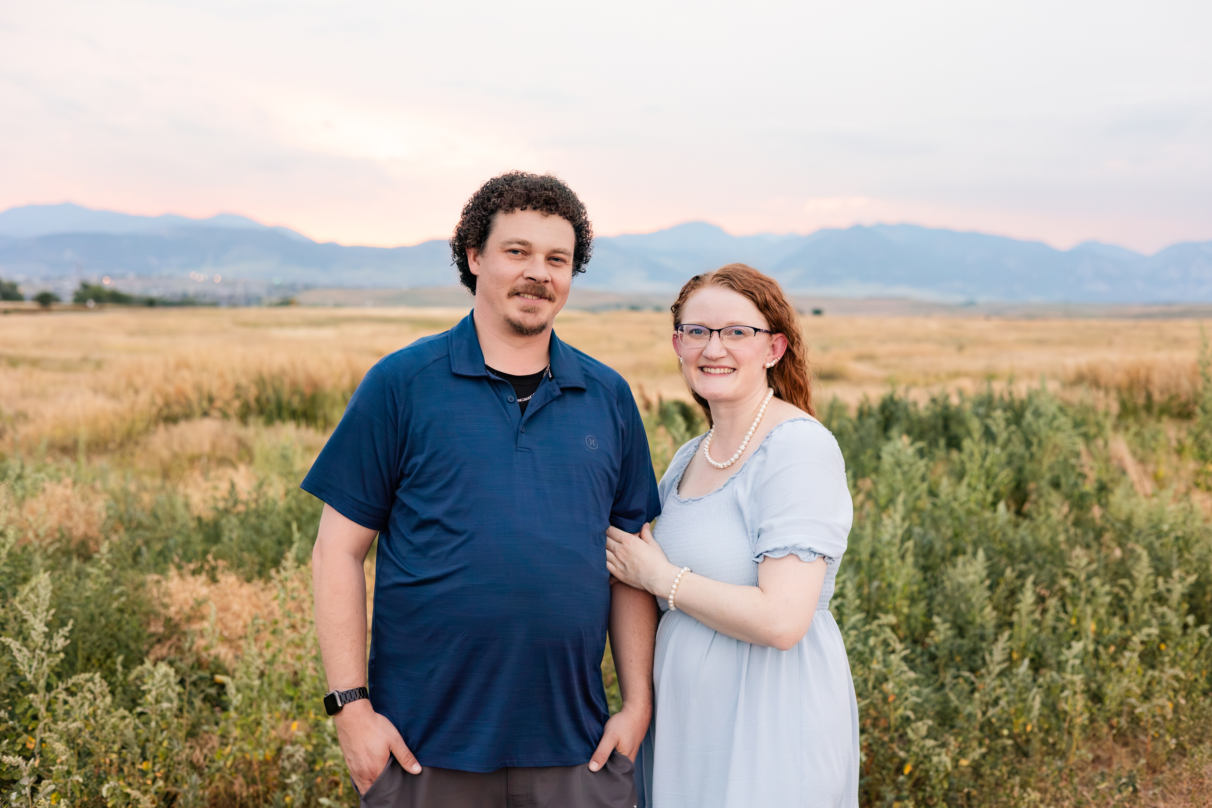 Husband and wife smile at the camera