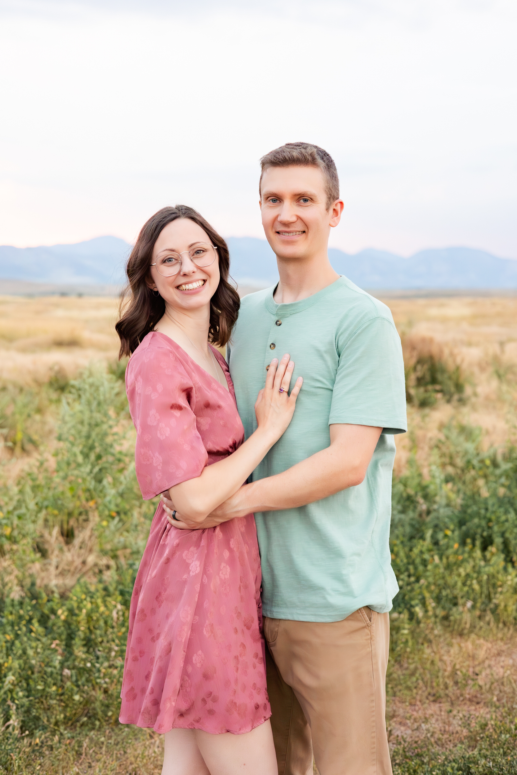 Husband and wife smile at the camera
