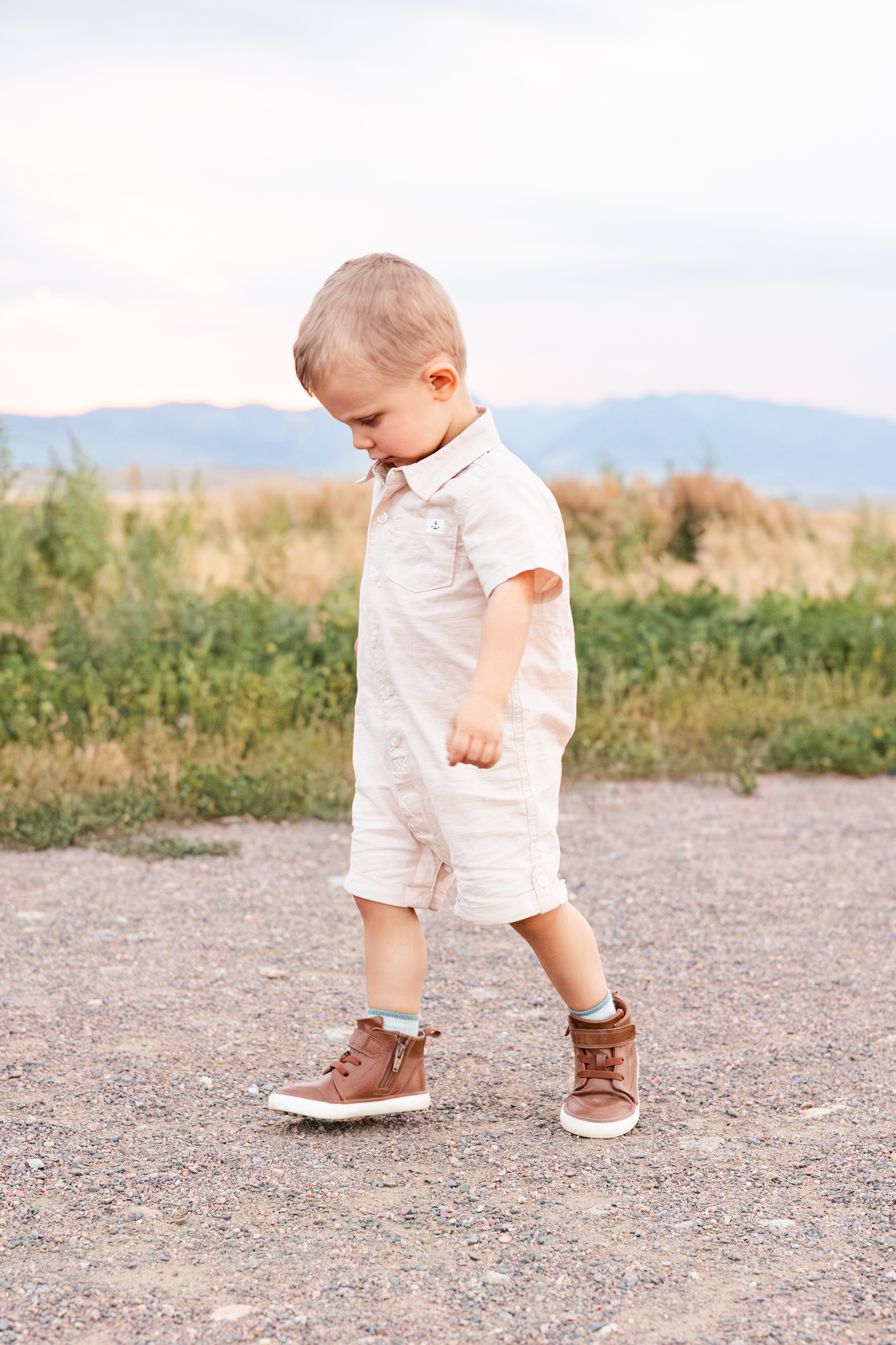 Toddler boy walking on a path