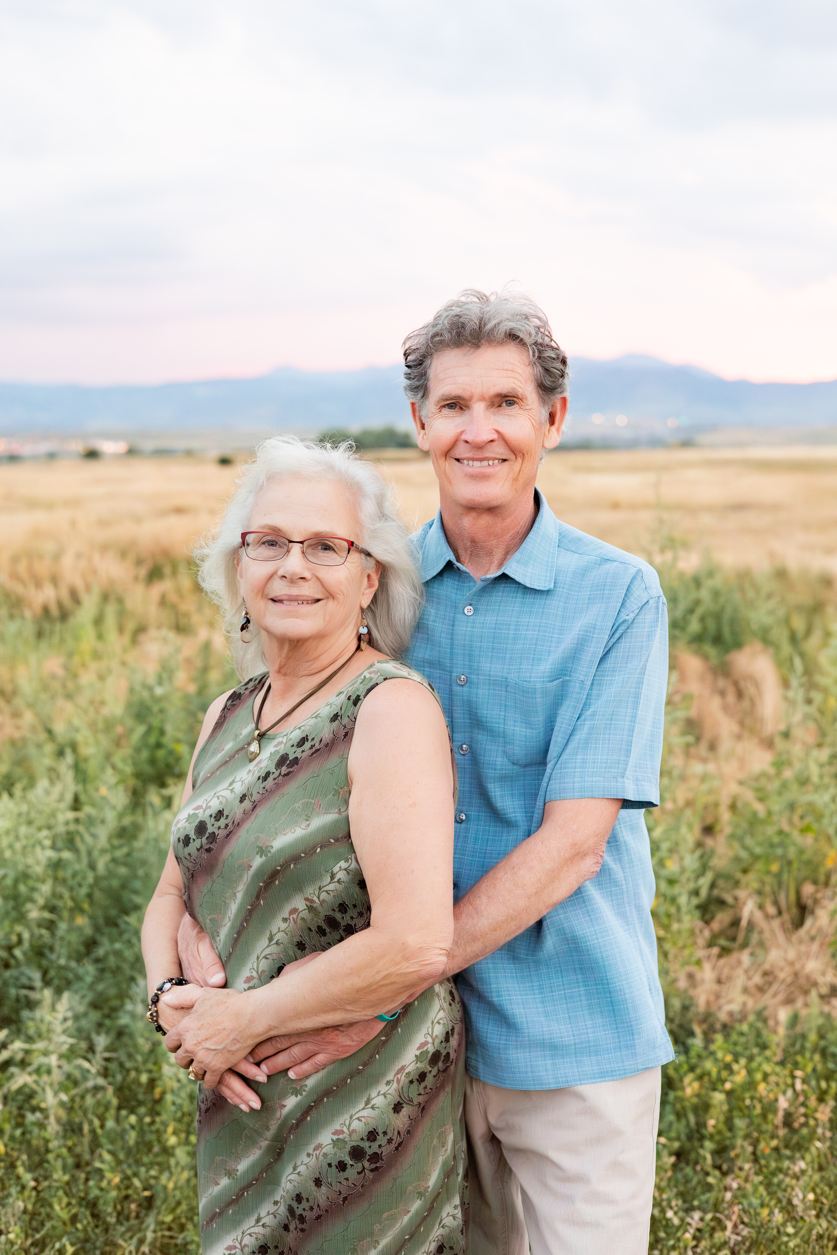 Husband and wife smile at the camera