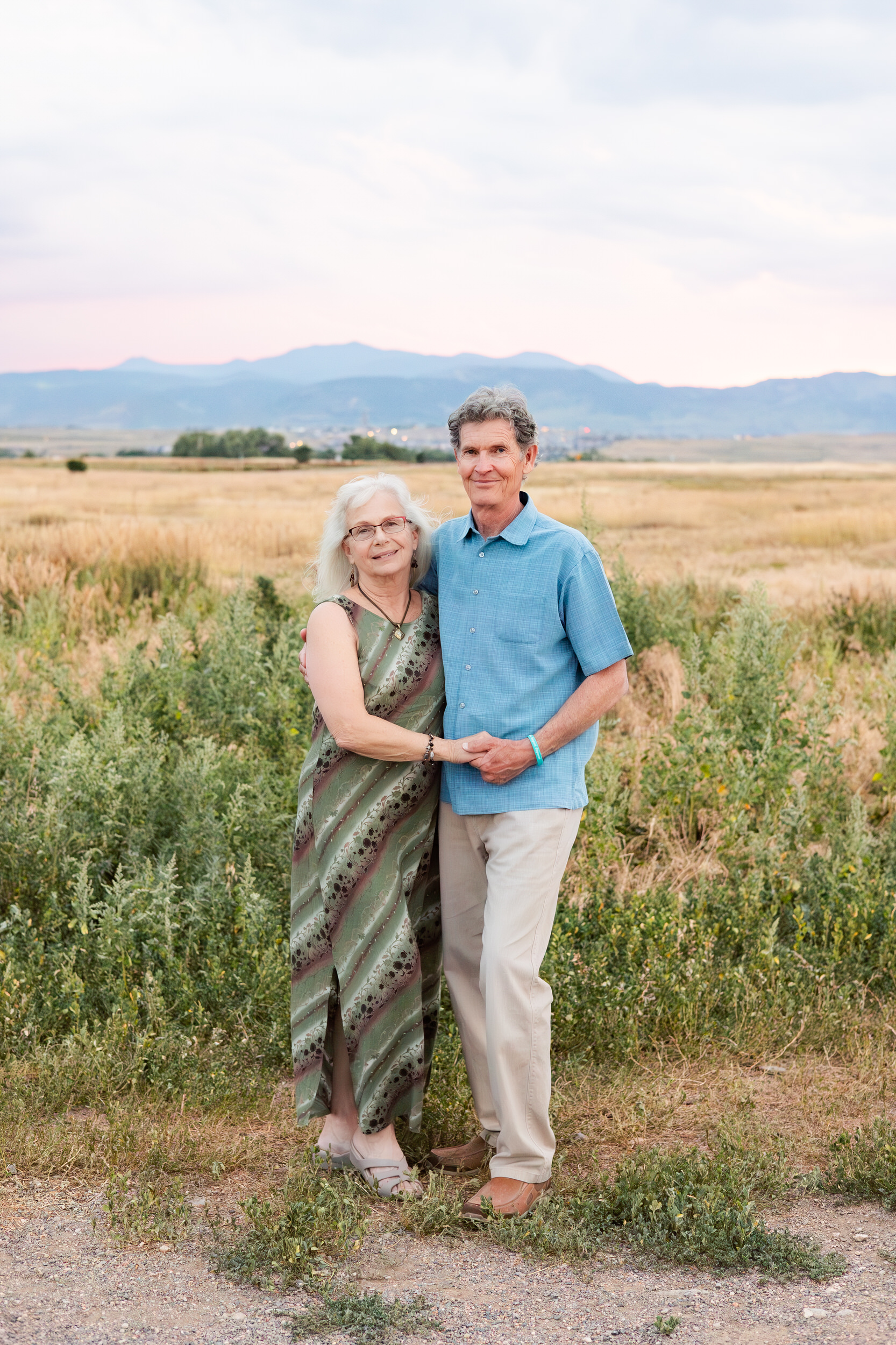 Husband and wife smile at the camera