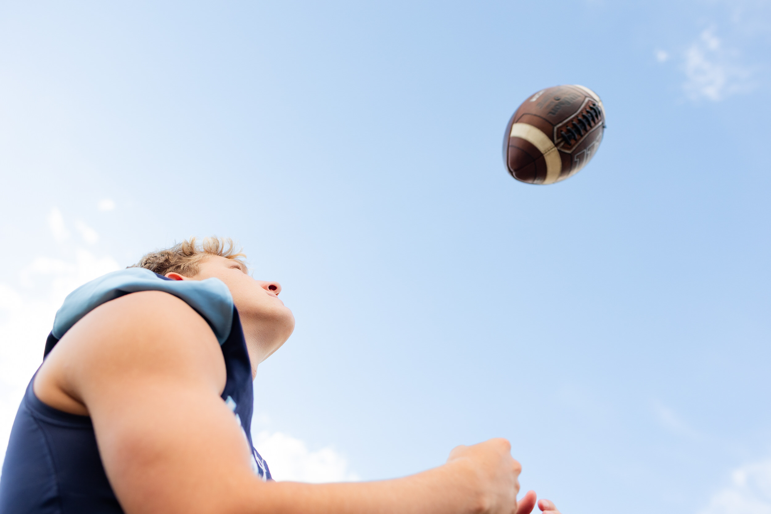 Young man catching a football