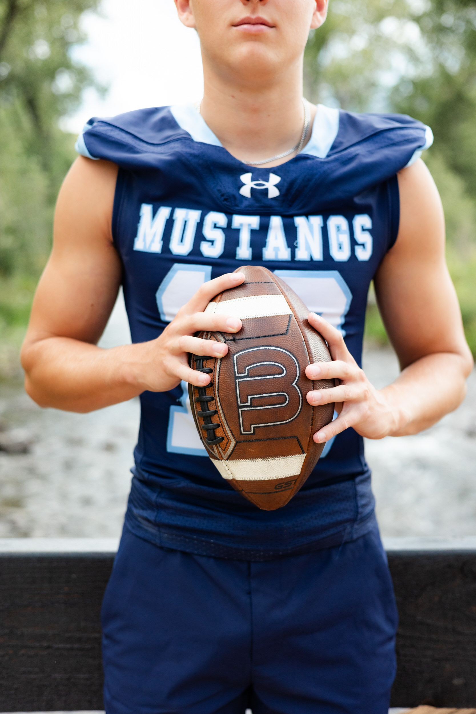 Close up of a football and school football jersey