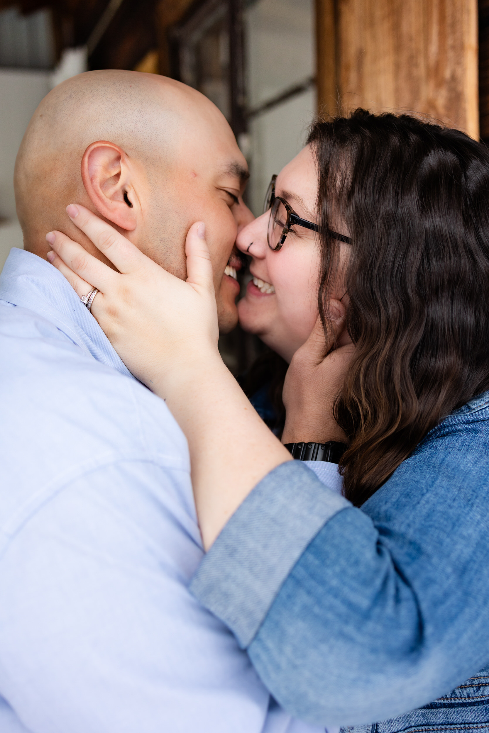Husband and wife are about to go in for a kiss.