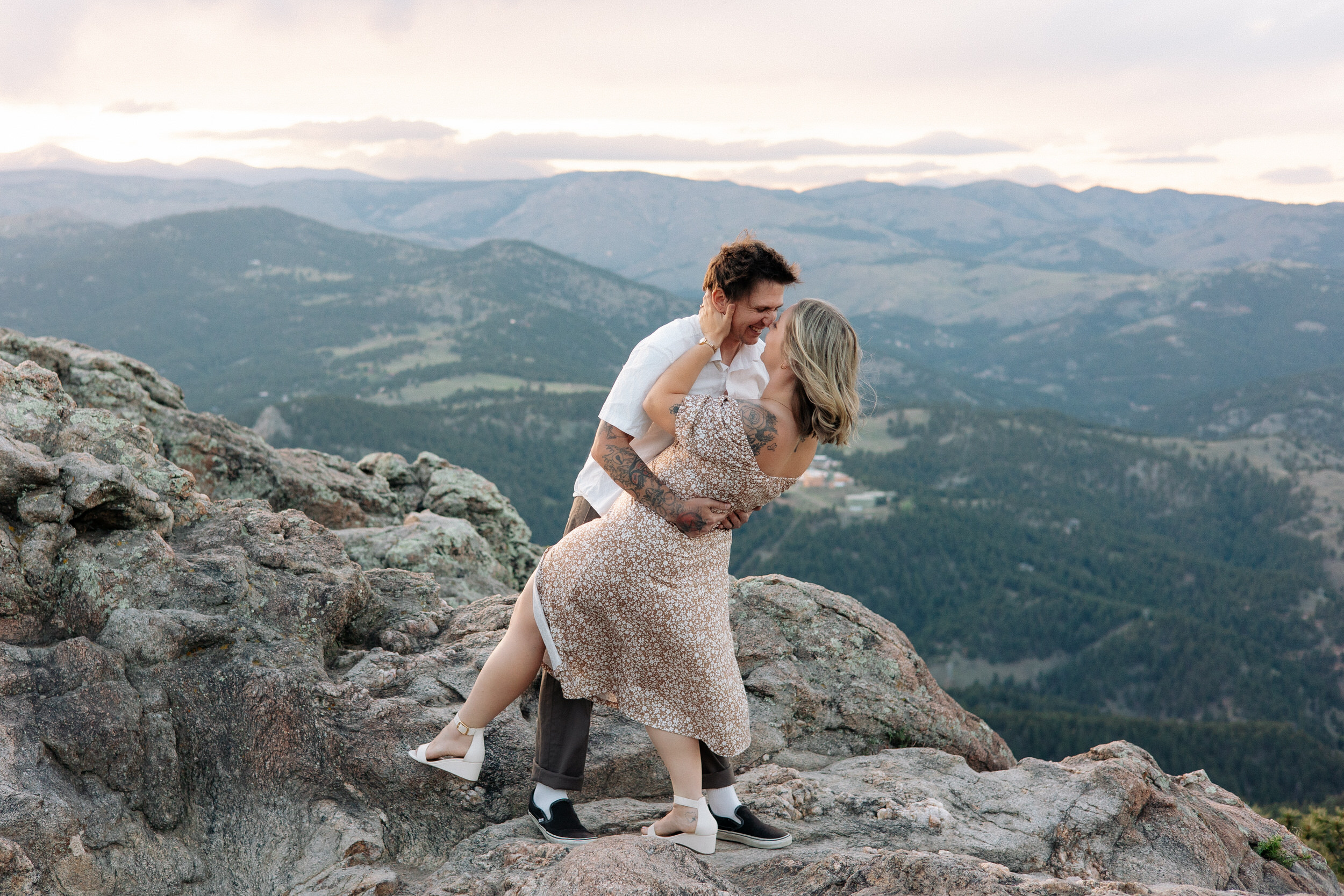 Husband and wife give each other Eskimo kisses during their anniversary photoshoot in Boulder, Colorado.