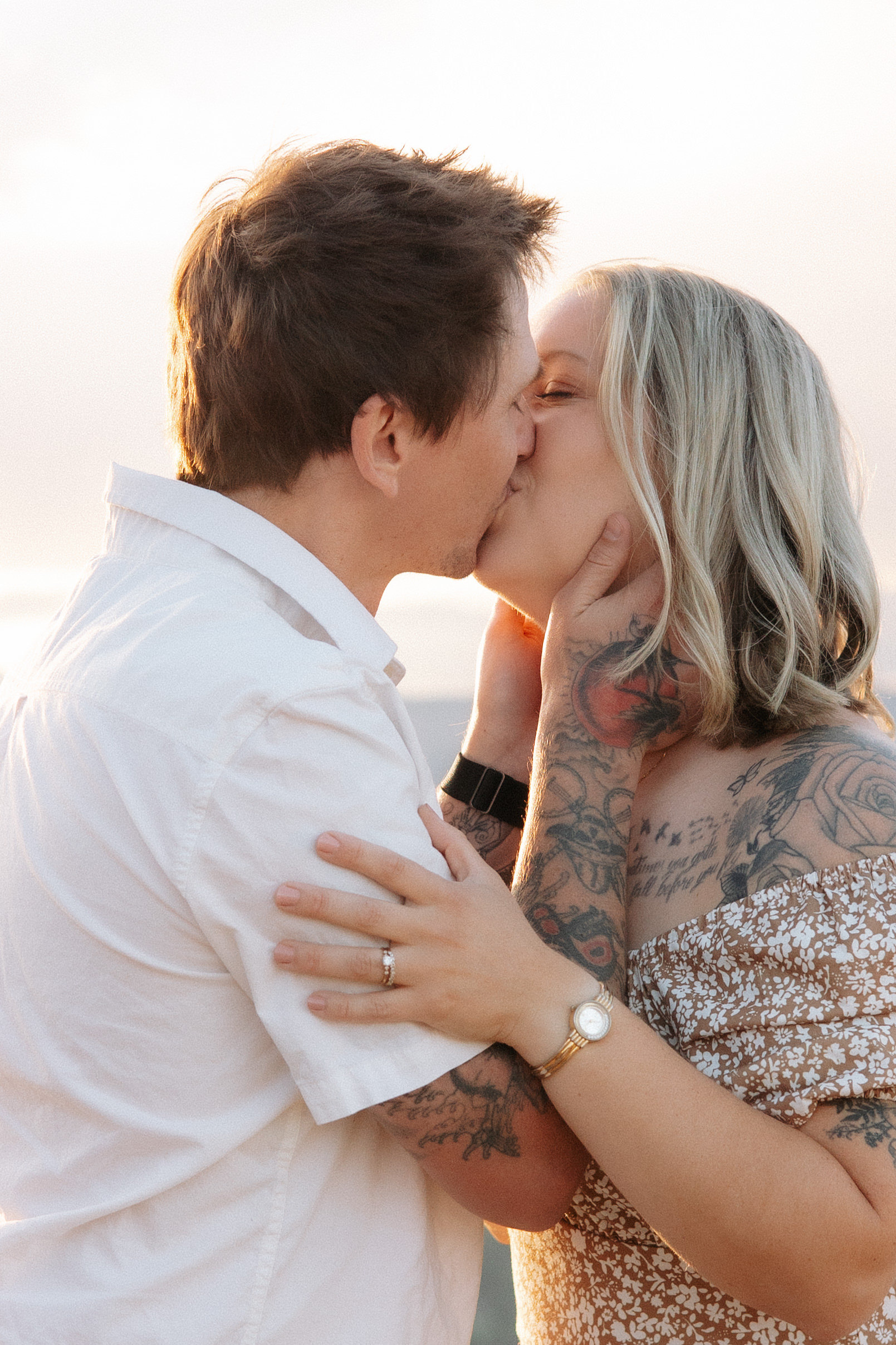 Husband and wife share a kiss at Lost Gulch Overlook in Boulder, Colorado.